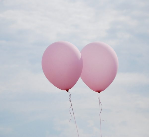 Pink balloons in the sky
